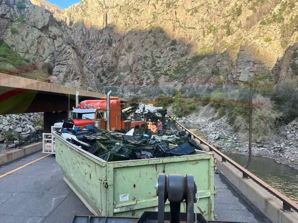 Crews have hauled away several dumpsters of debris from a commercial semi-truck crash.