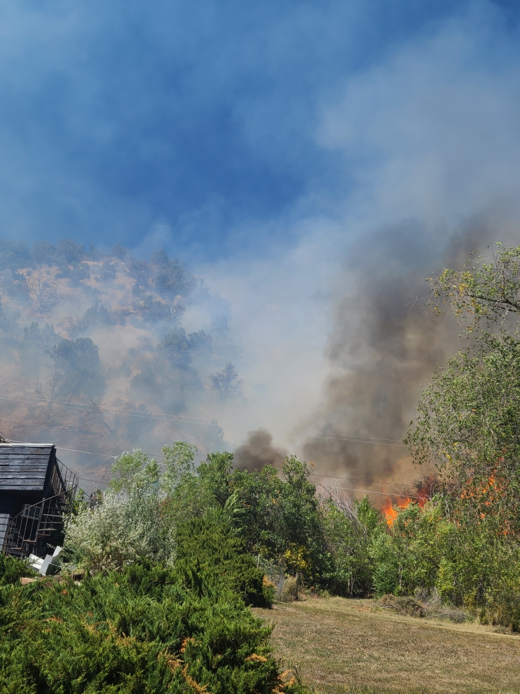 Flames behind homes in West Glenwood Sept. 23, 2023