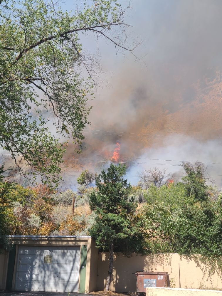 Flames behind structures in West Glenwood Sept. 23, 2023